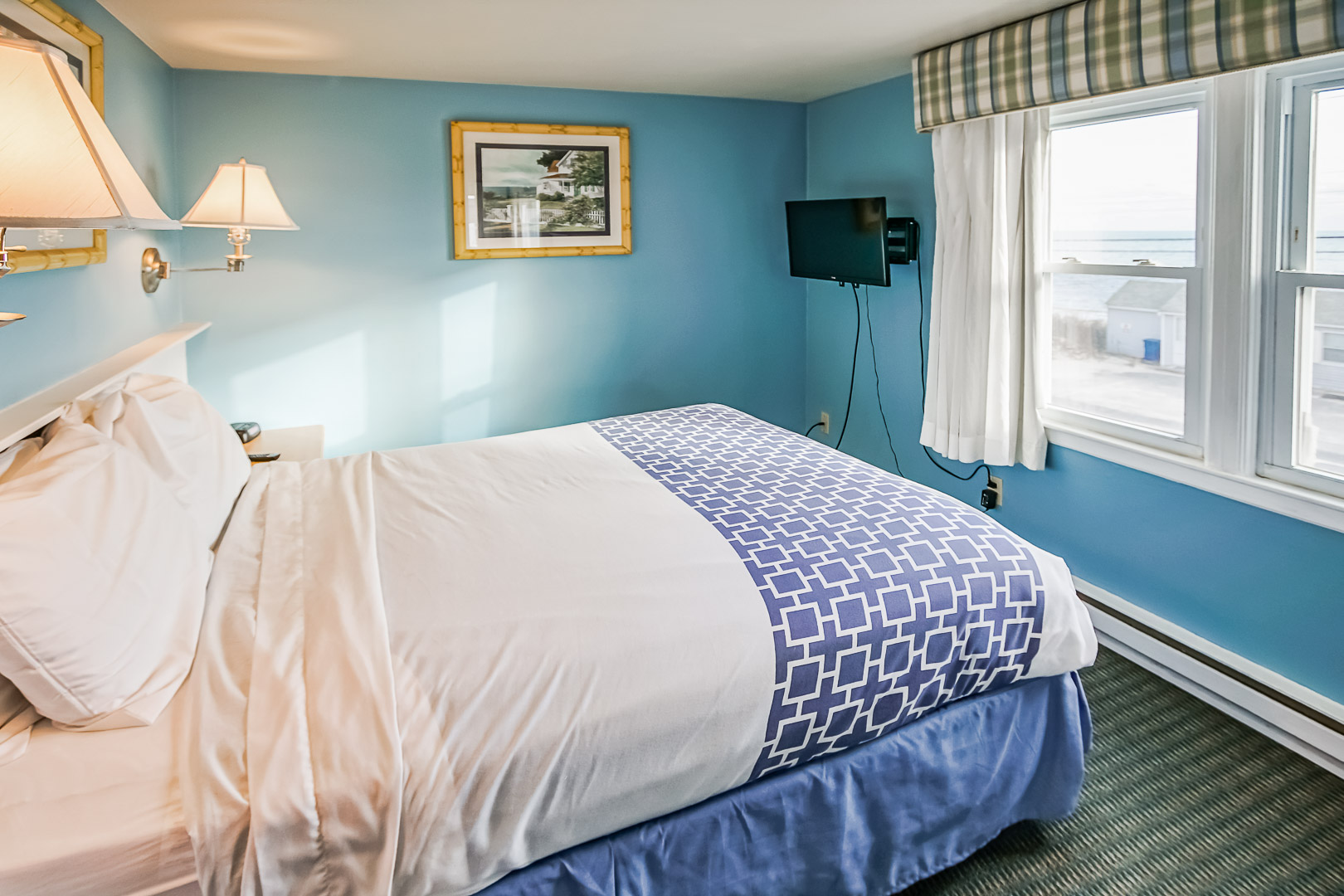 A vibrant master bedroom at VRI's Seawinds II Resort in Massachusetts.